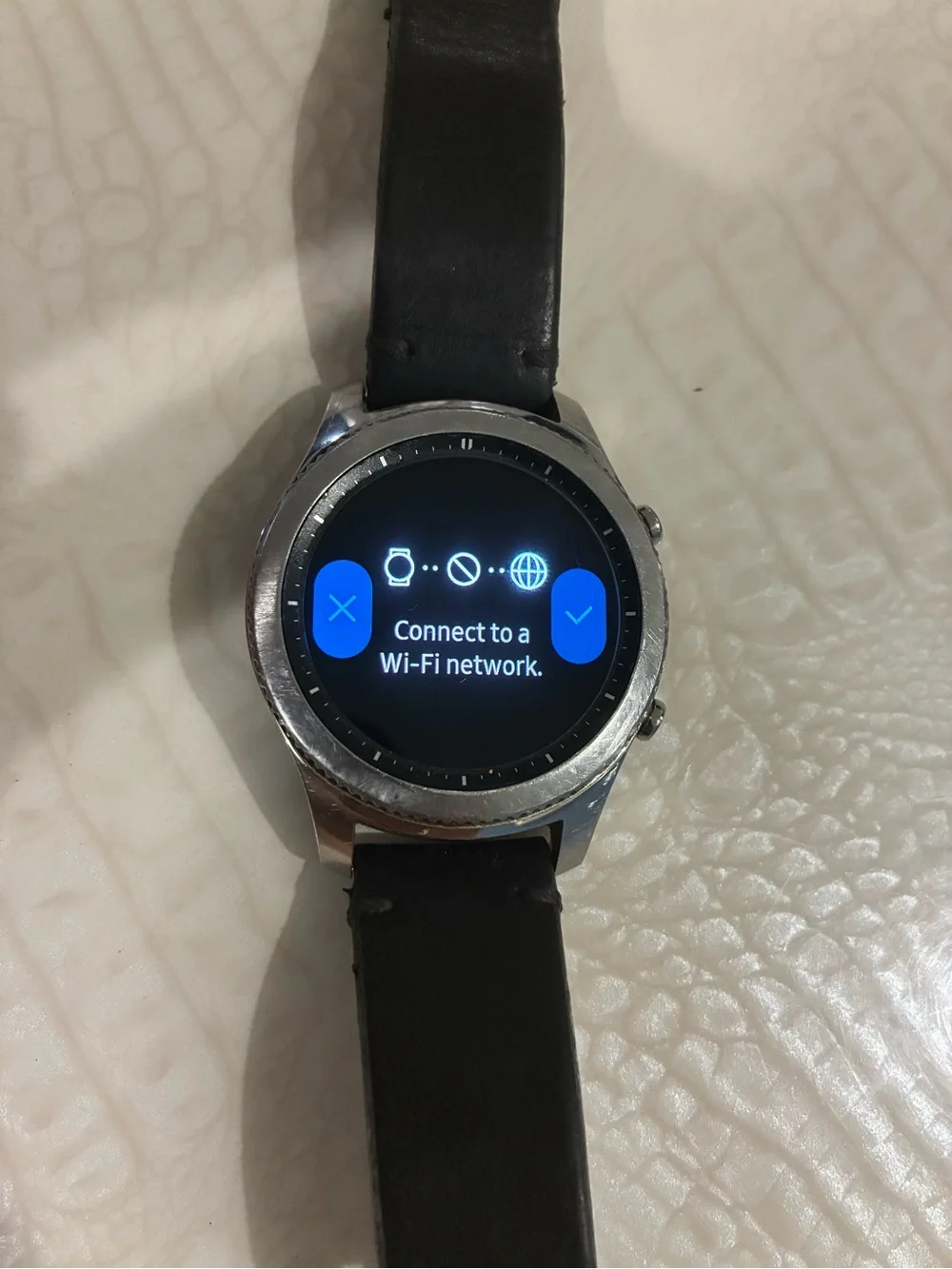 Samsung Silver Smartwatch with Black Strap and Blue Display